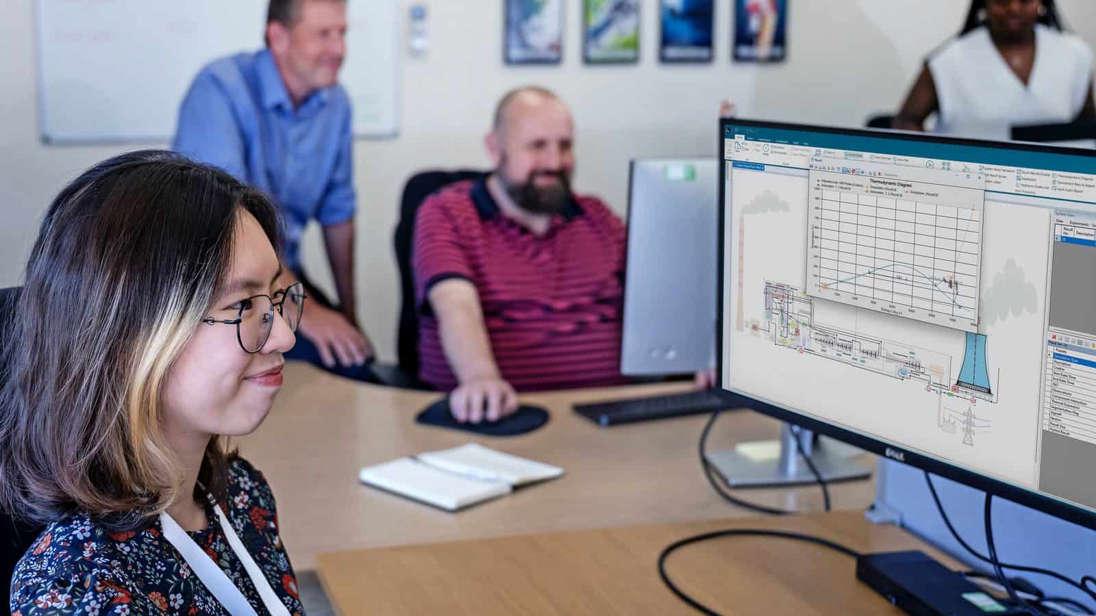 Engineer at a workstation with Simcenter Flomaster on screen showing a power plant network and a thermodynamic diagram