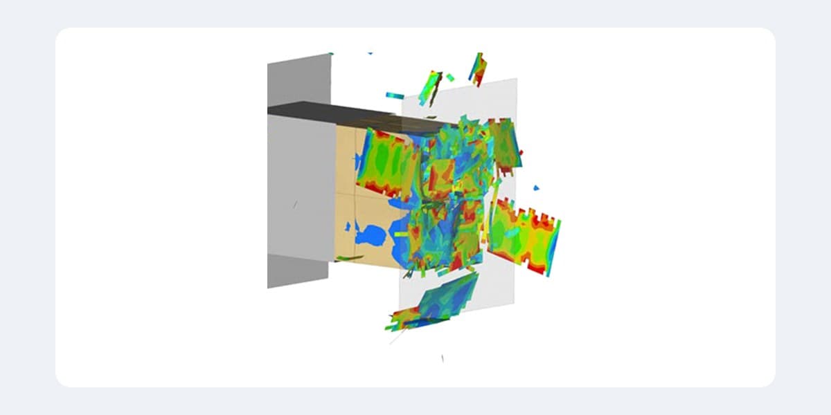 Composite panel failing under impact, with tensile failure index contours on the fragments